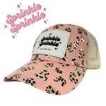 Sprinkle Sprinkle Ponytail Hat – Blush Leopard with White Leather Patch Engraved Logo – Adjustable Trucker Cap