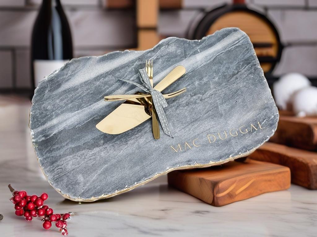 a large stone with a gold bow on top of it