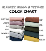a stack of blankets with the names of them
