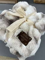 a white teddy bear with a tag on it