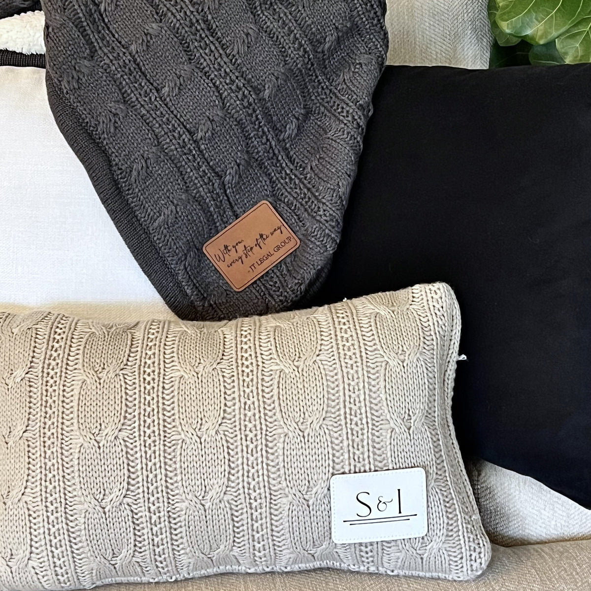 a pile of pillows sitting on top of a couch