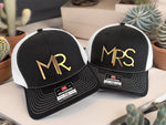 a couple of hats sitting on top of a table