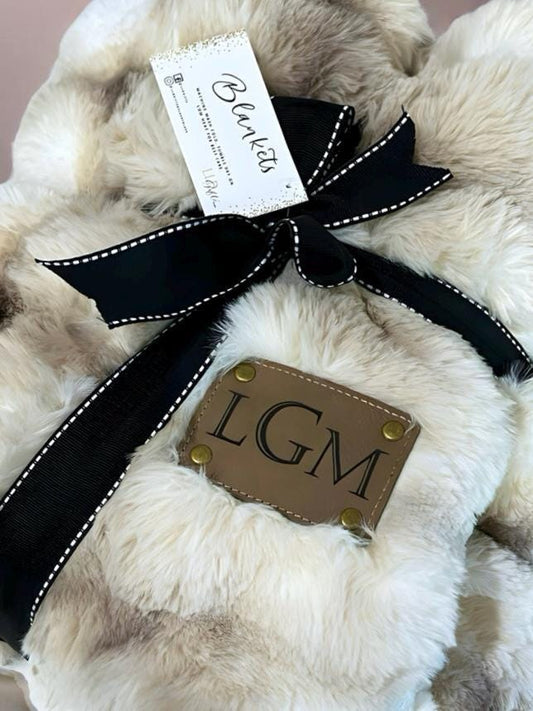 a white teddy bear with a tag on it