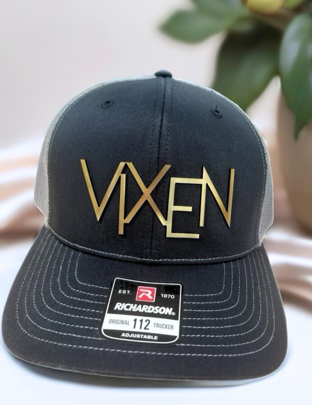 a black and gold hat sitting on top of a table