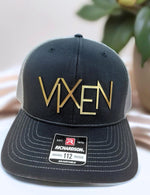 a black and gold hat sitting on top of a table