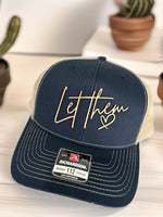 a hat with the word let the fun written on it